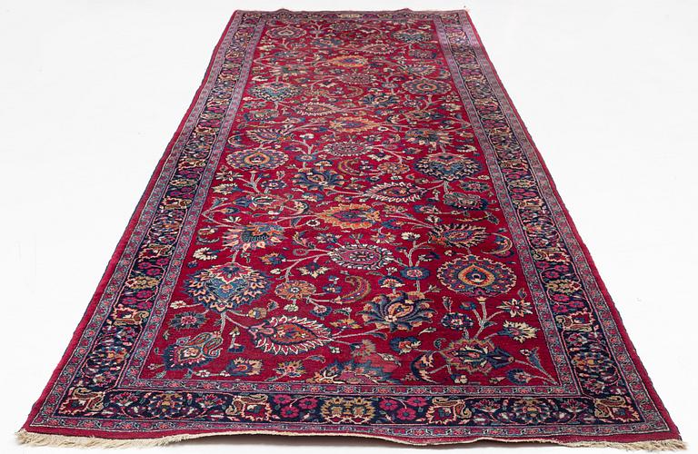 A semi-antik Mashad, signed Saber, carpet, ca 460 x 152 cm.