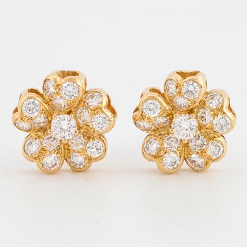 Brilliant-cut diamond flower earrings.