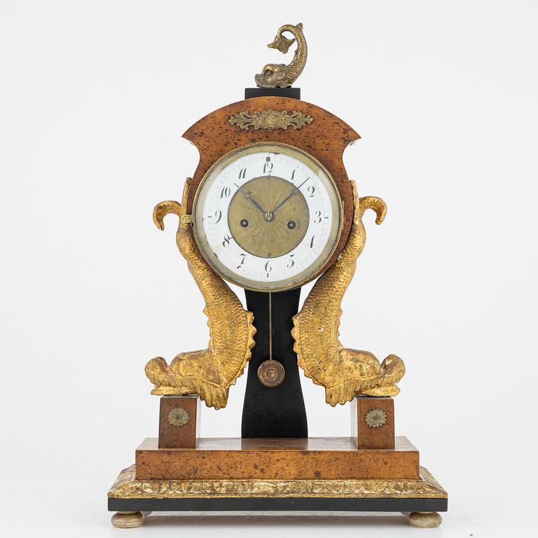 An Empire mantle clock, 19th Century.