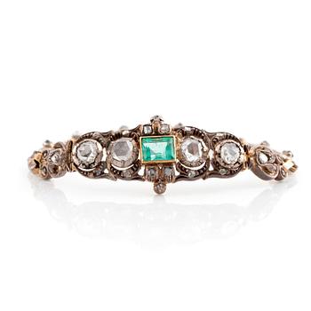 A 14K gold and silver bracelet set with an emerald and rose-cut diamonds.