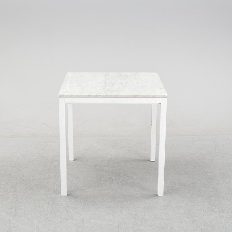 A marble top table, 21th century.