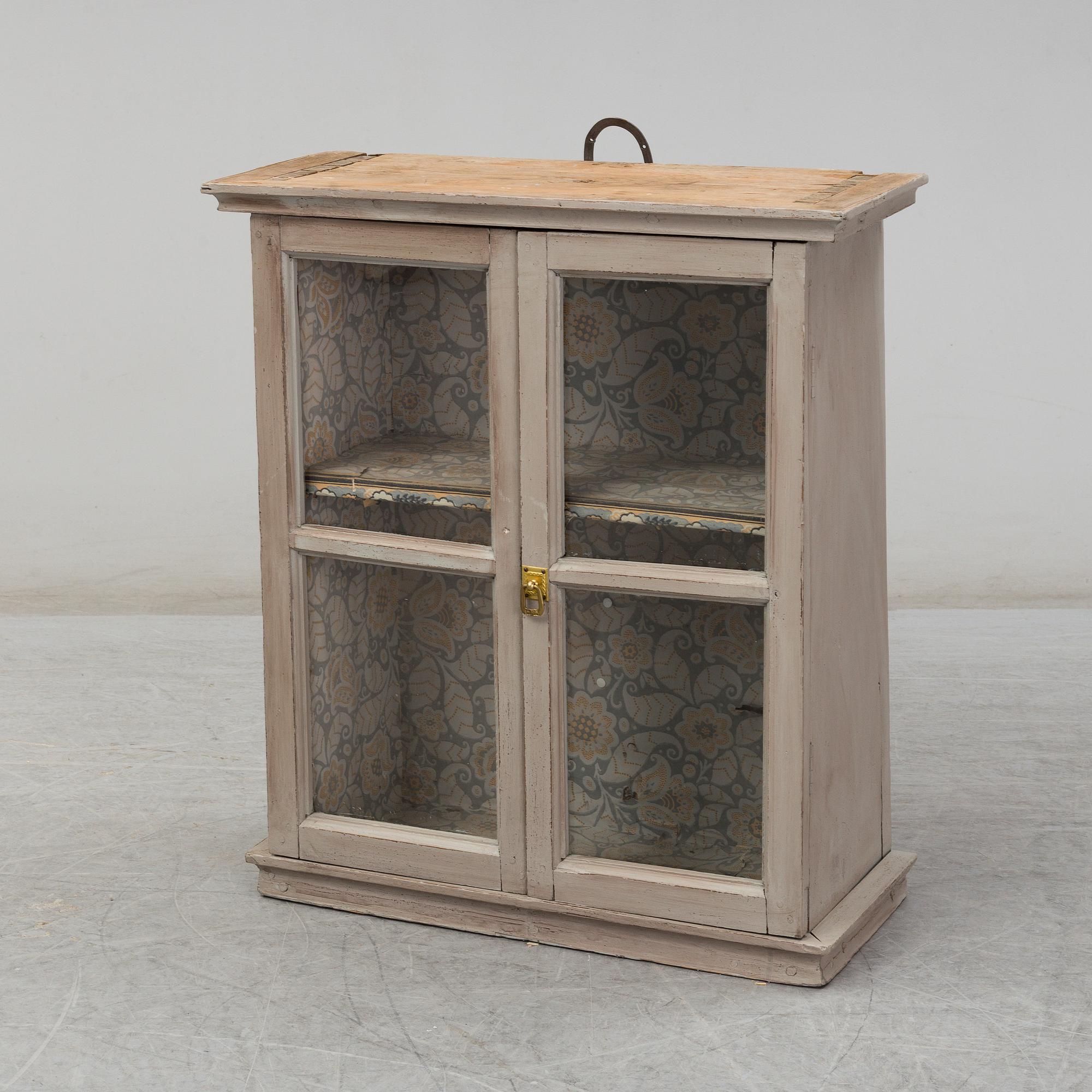 a wall-cabinet from the 19th century.