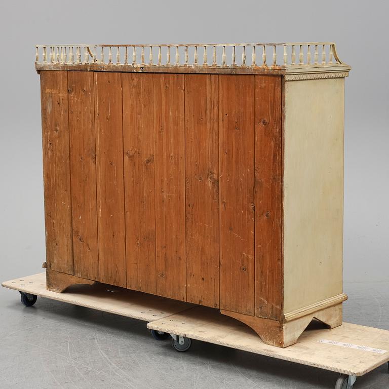 An early 19th Century painted late Gustavian cupboard.