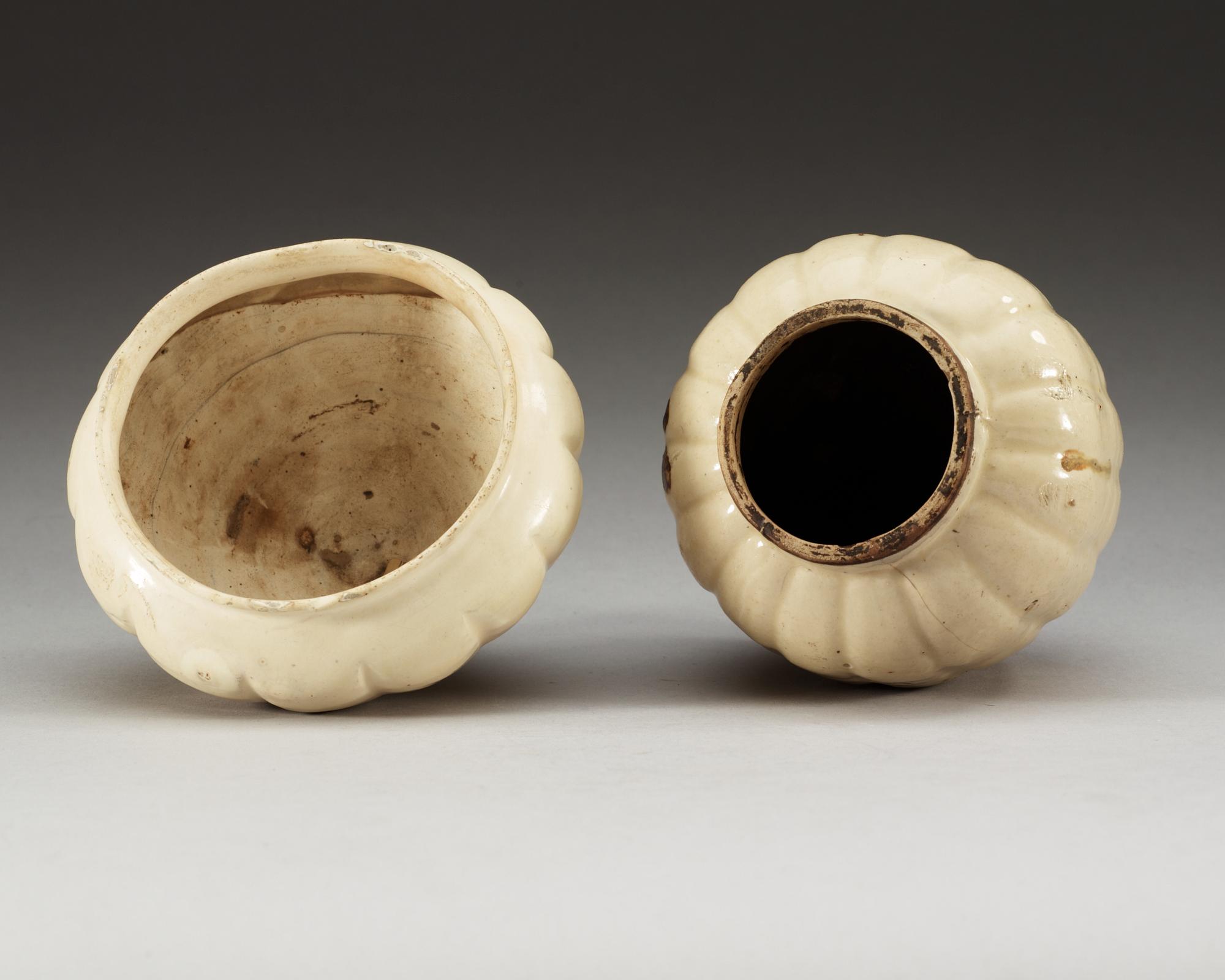 A white glazed bowl and a chizhou vase, Song (960-1279) and Yuan dynasty (1271-1368).
