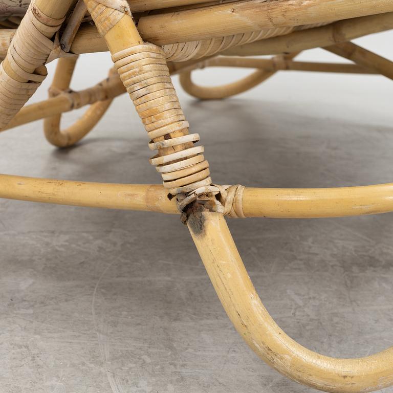 A rattan sofa, table and a pair of armchairs, second part of the 20th Century.