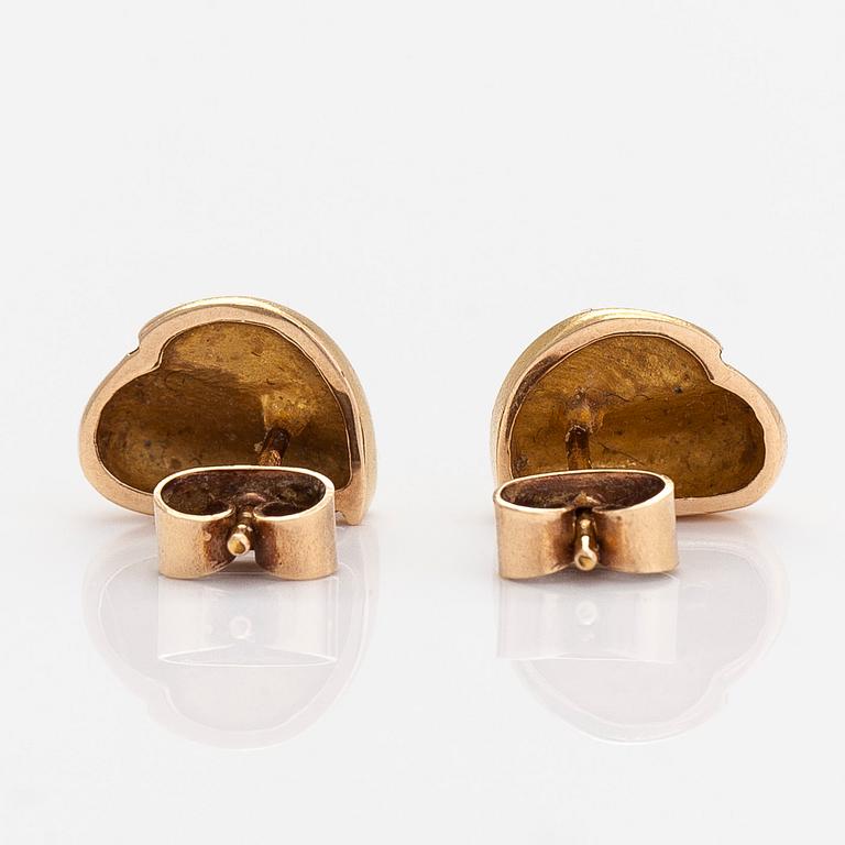 A pair of 14K gold earrings.