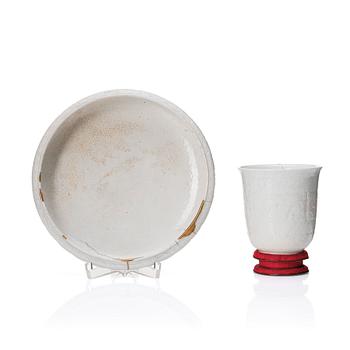 831. A Chinese blanc de chine cup and dish, Qing dynasty, Kangxi (1662-1722).