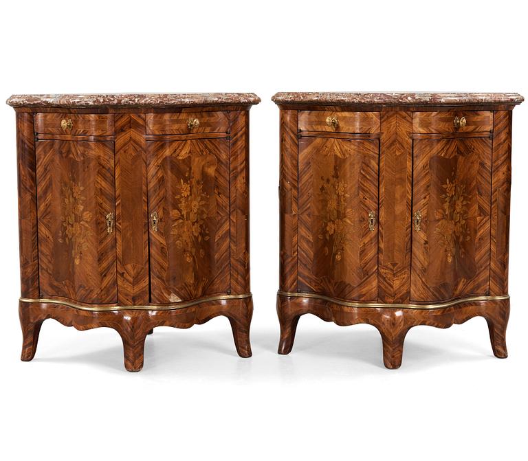 A pair of Louis XV 18th century corner cupboards.