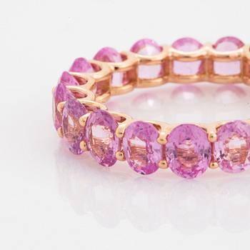 Oval faceted pink sapphire ring.