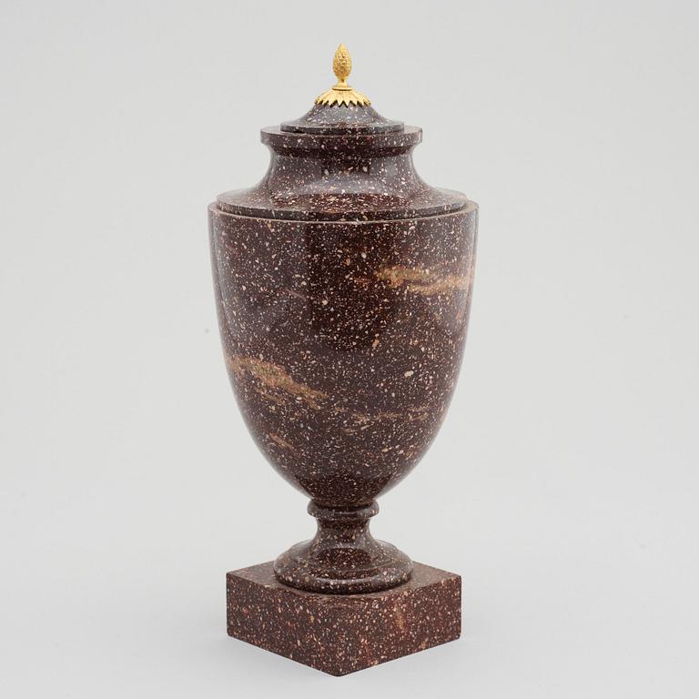 A late Gustavian 19th Century porphyry and gilt bronze urn.