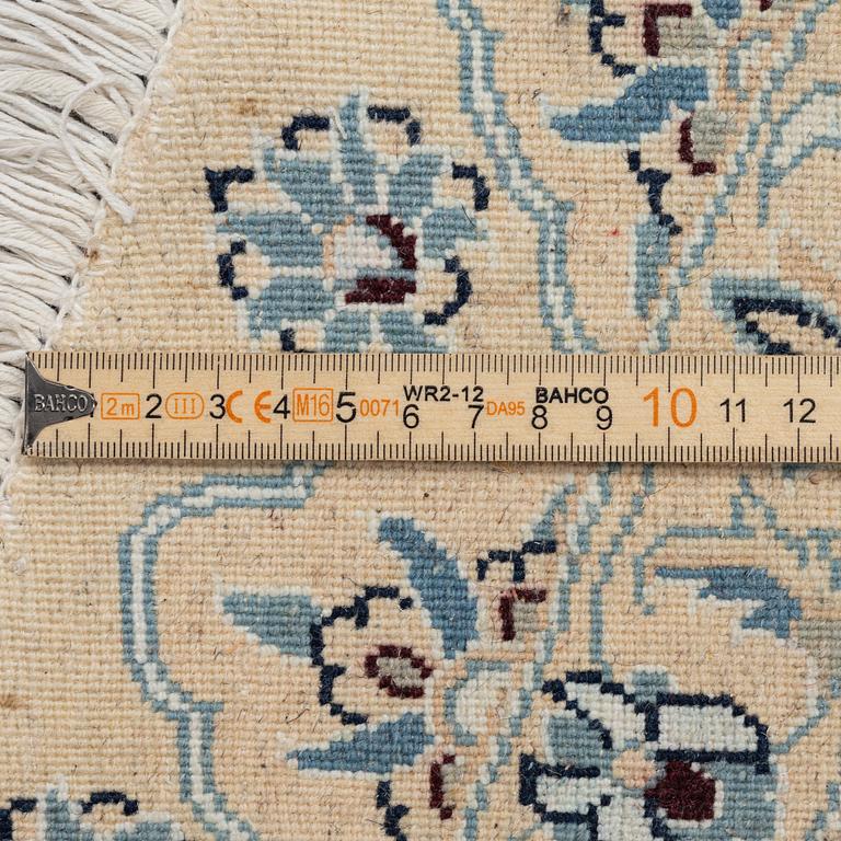 A Nain rug, diameter 243 cm.