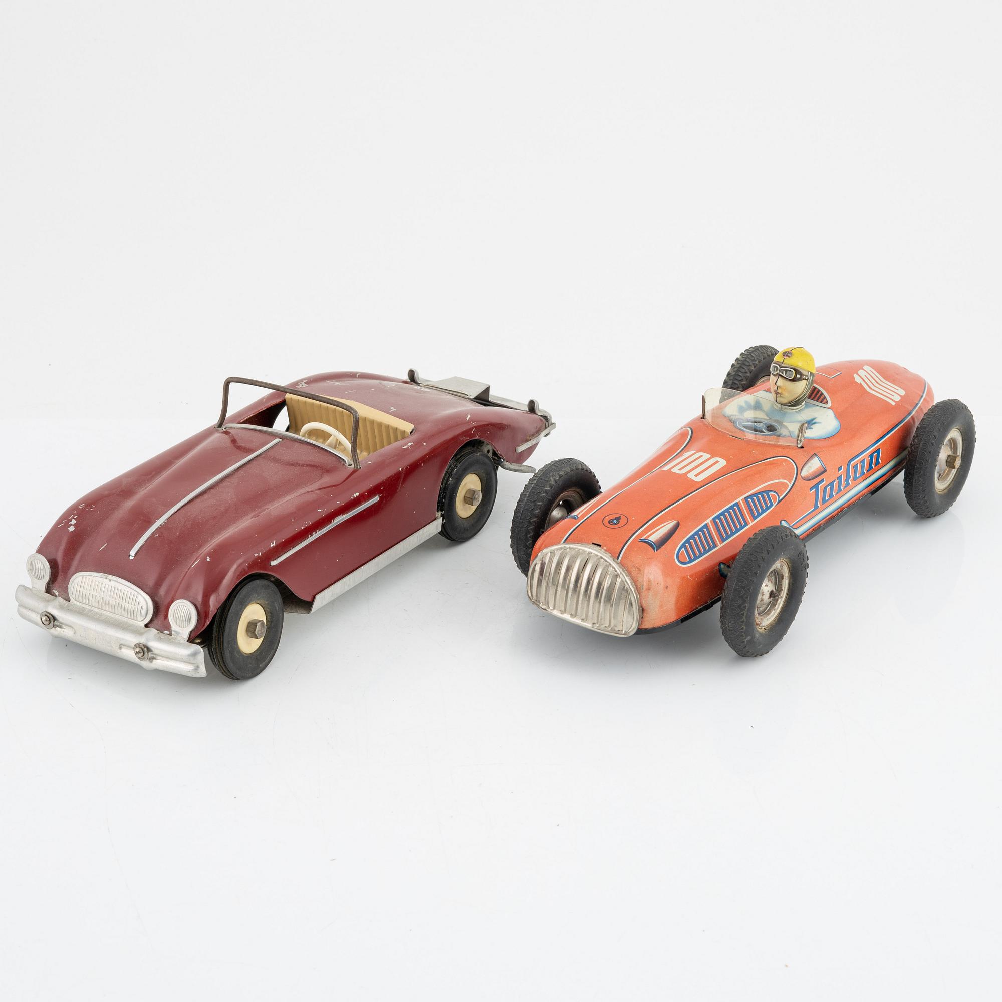 Four toy cars, including Nomura Toys, Japan, 20th century.