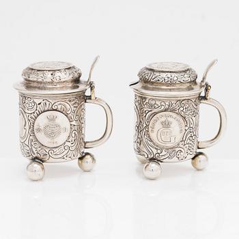 A pair of silver salt and mustard tankard,  C.G. Hallberg, Stockholm 1911 and 1914.
