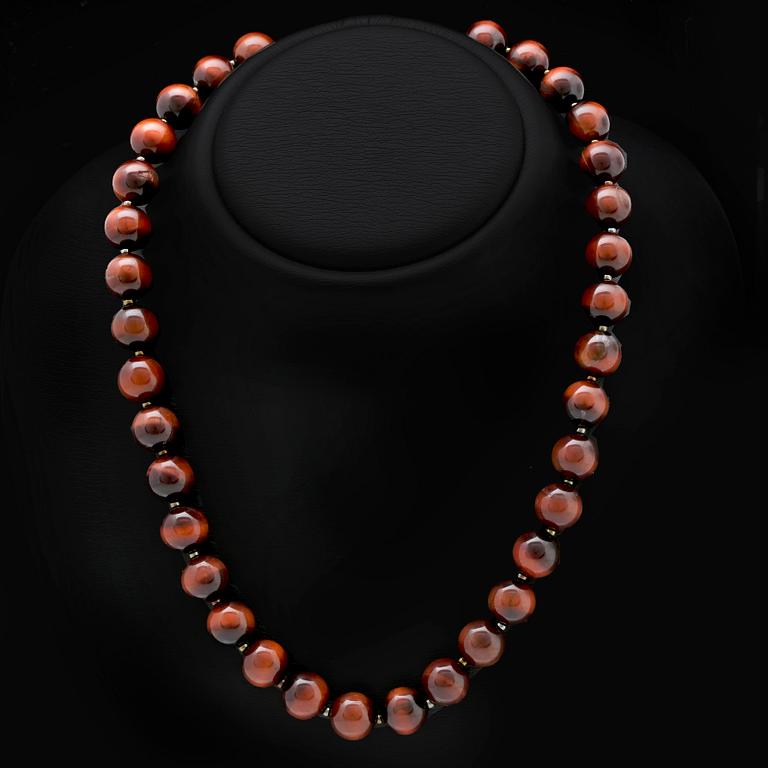 Collier tigeröga kulor ca 12 mm och mindre glaskulor, lås i metall, ca 50 cm.