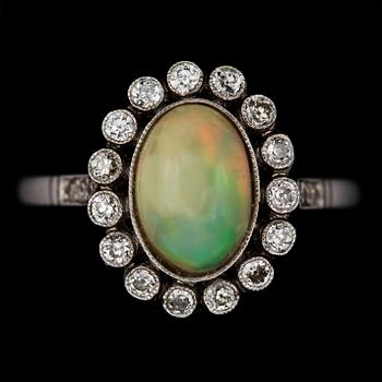 An opal, 1.25 cts and diamond ring.