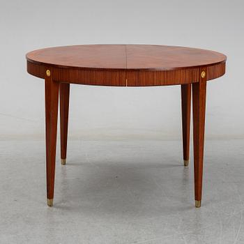 A gustavian style mahogany dining table from the mid 20th century.