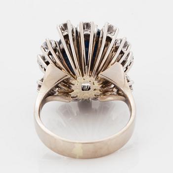 Cabochon-cut sapphire and brilliant-cut diamond cocktail ring.