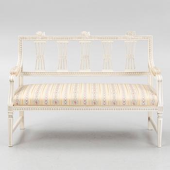 A sofa, three chairs and a table, Gustaivan style and of the Gustavian period, 19th-20th century.