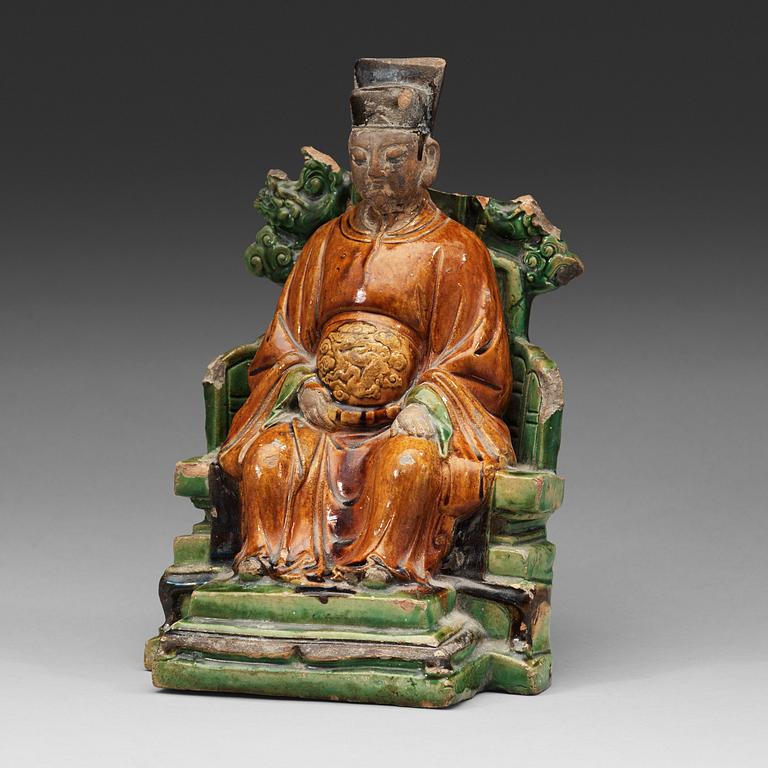 A ceramic sculpture of a seated daoist dignitary, Ming dynasty, (1368-1644).