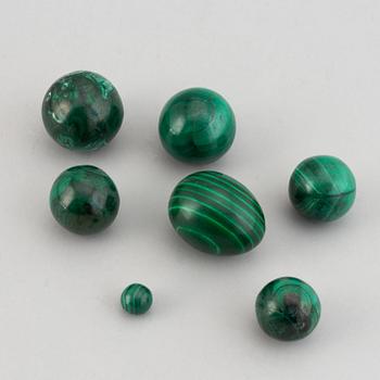 Six 20th century malachite balls and an egg.