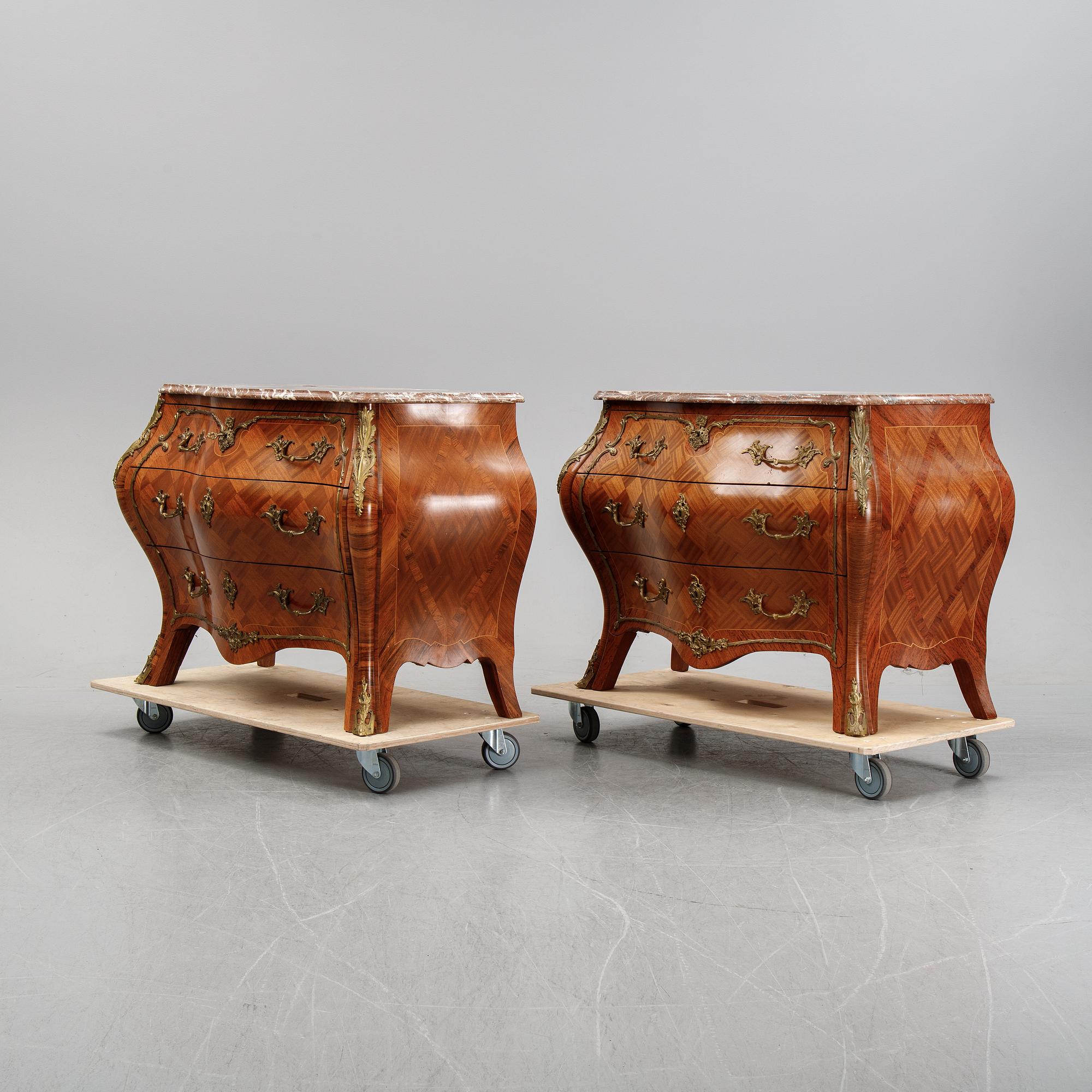 A pair of rococo style chest of drawers, mid 20th Century.