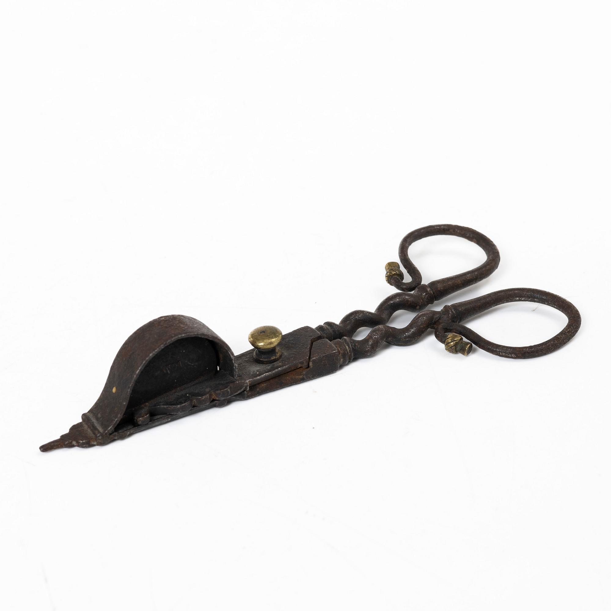 A set of a wrought iron key and wick snuffer, 17th - 18th century.