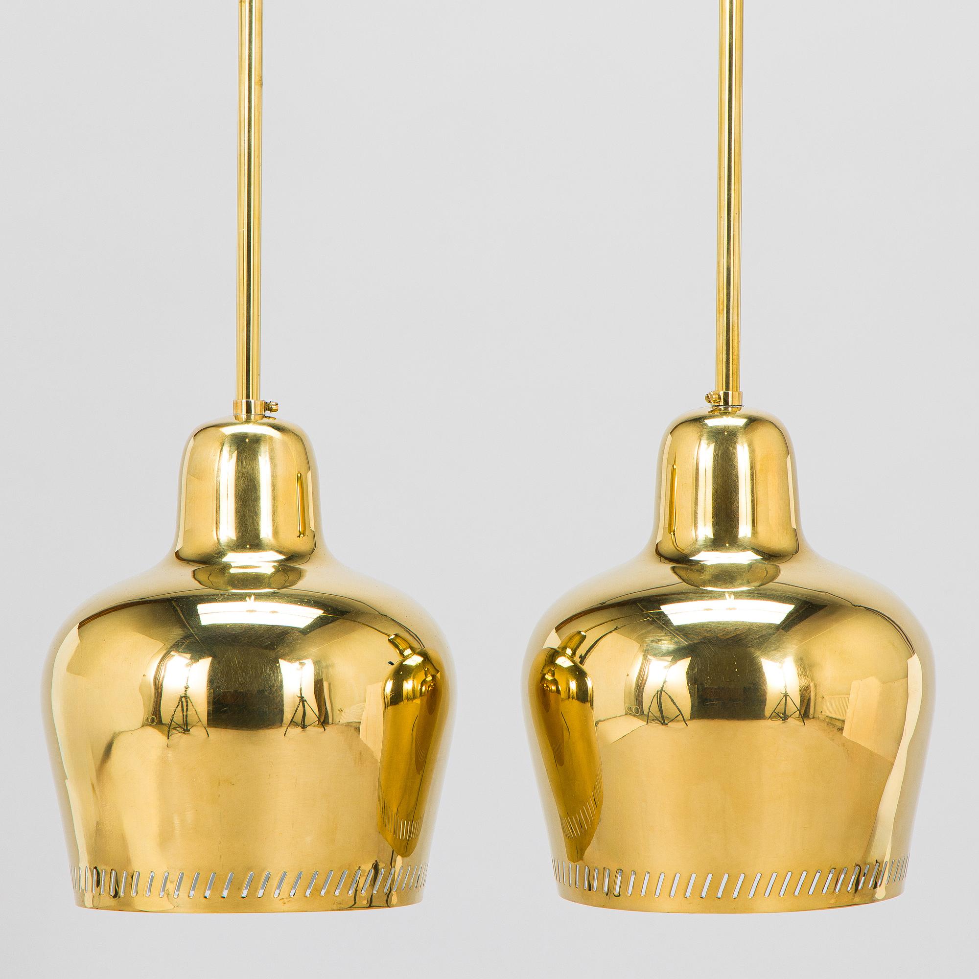 Paavo Tynell, a pair of mid 20th century ceiling lights, model 1699, for Taito / Idman.