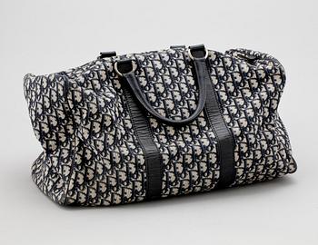 A blue monogram canvas weekendbag by Christian Dior.