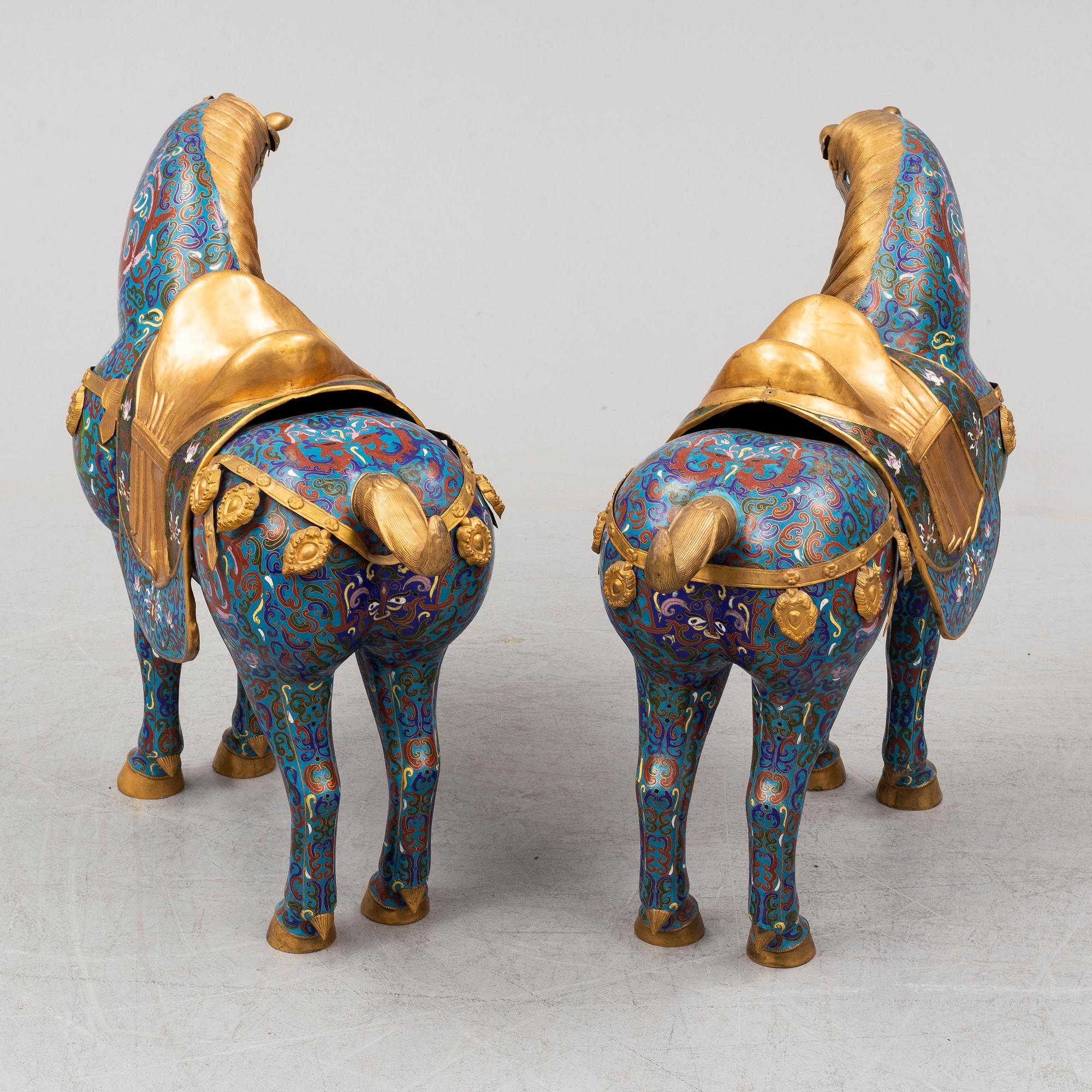 A pair of Chinese cloissoné horses, 20th Century.