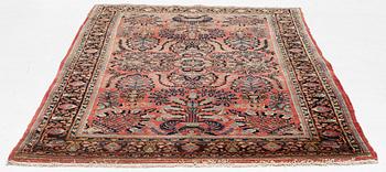 A semi-antique 'Mahajiran' Sarouk carpet, c 275 x 185 cm.