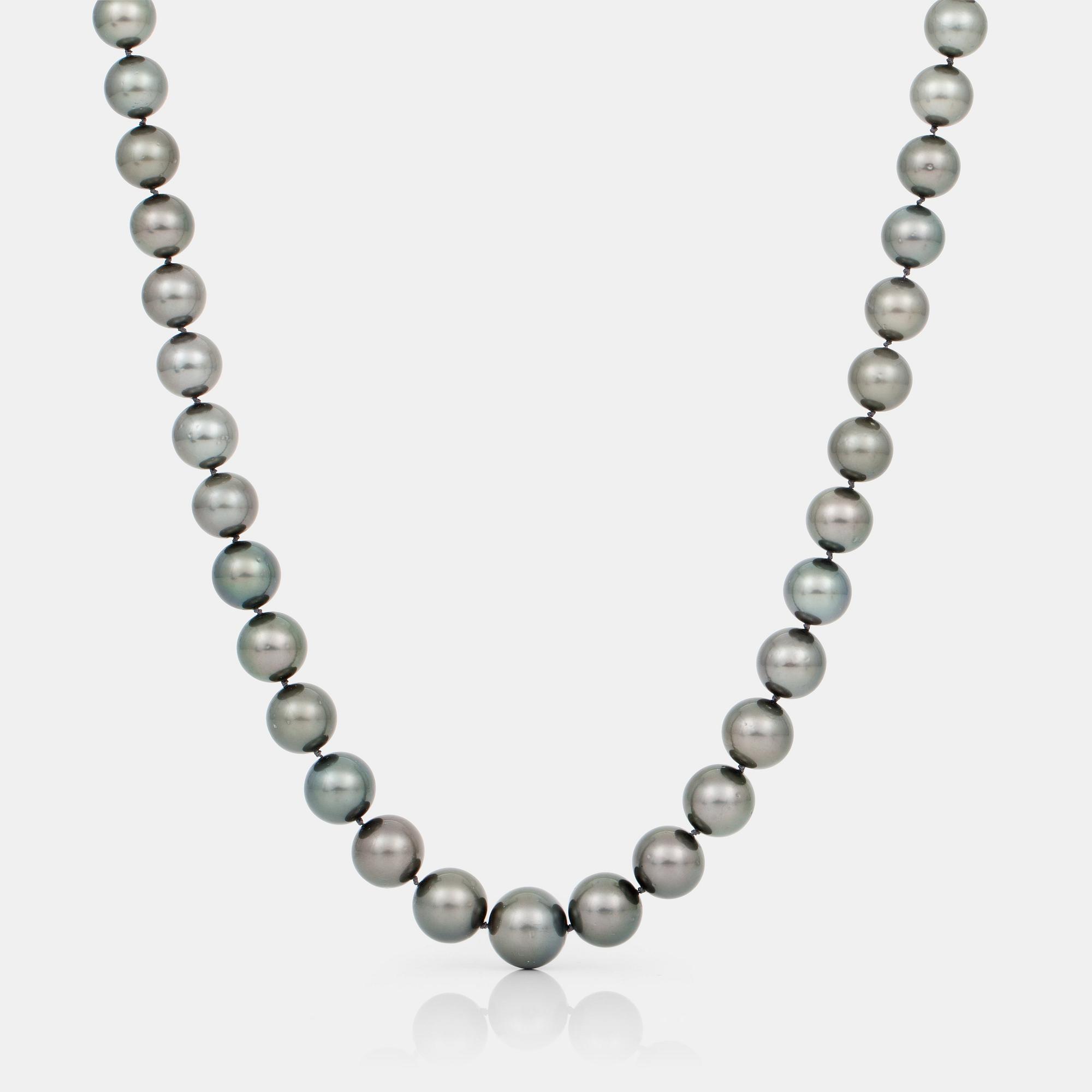 A cultured Tahiti pearl and brilliant-cut diamond necklace.