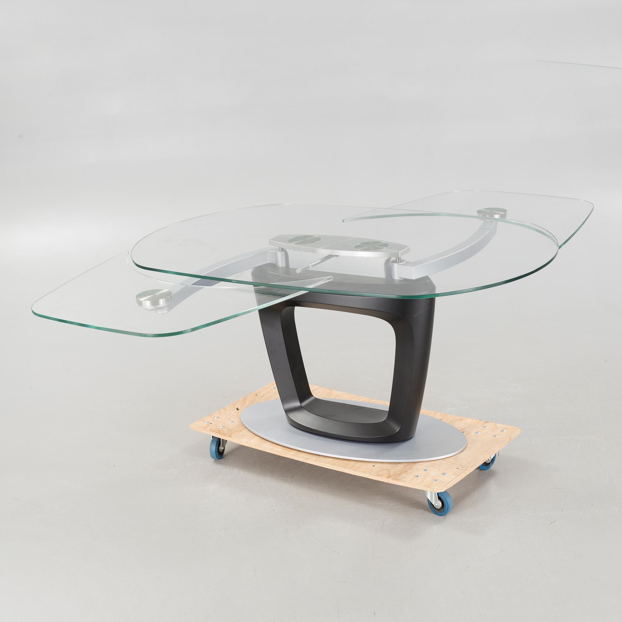 A 21st century "Orbital" dinner table by Pininfarina for Calligaris.