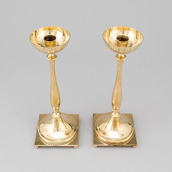 A pair of mid 20th century brass candlesticks by Gunnar Ander for Ystad Metall.