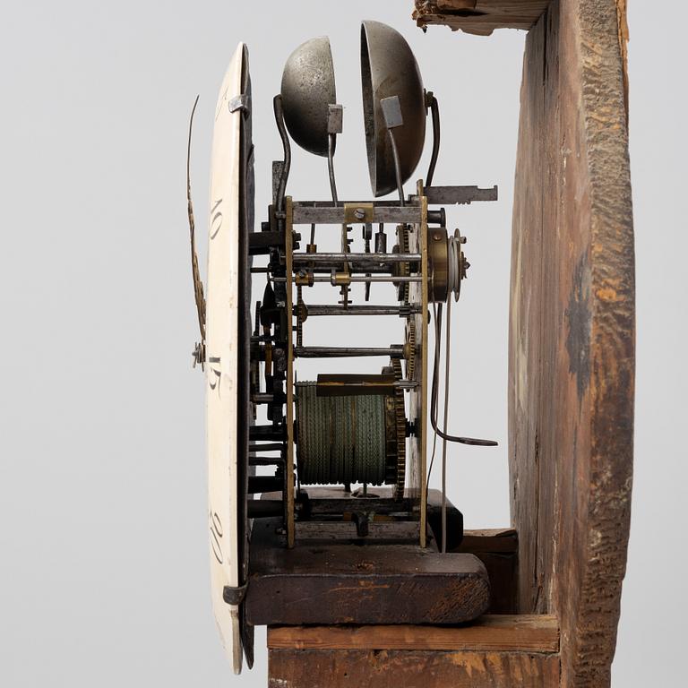 A long-case clock, 19th century.