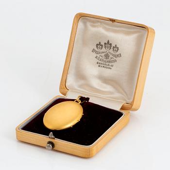 A 14K gold locket.