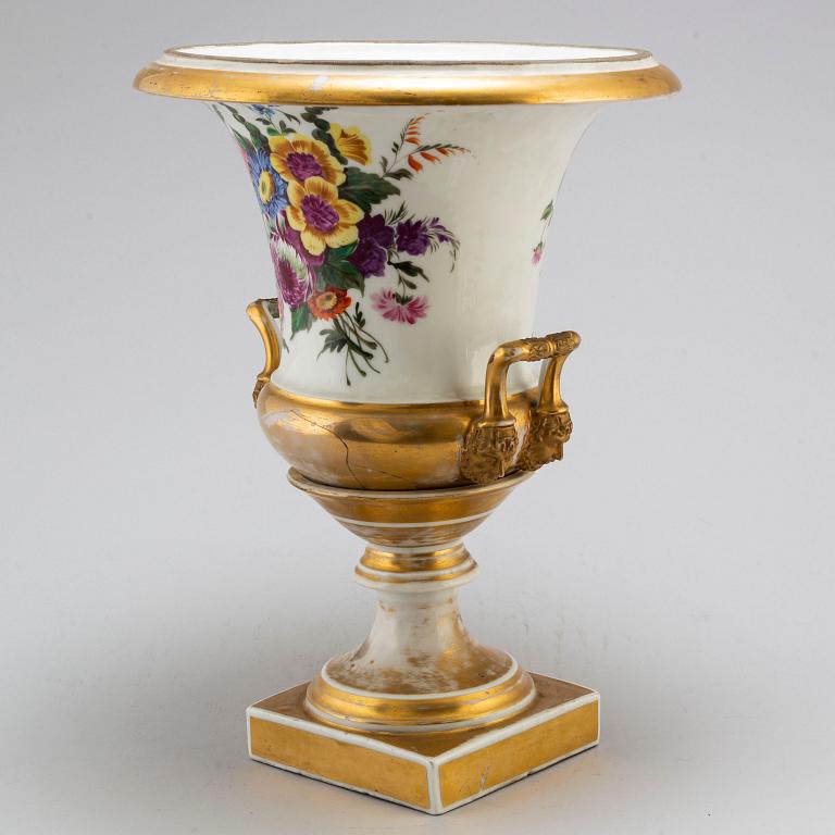 An empire porcelain urn, early 19th century.