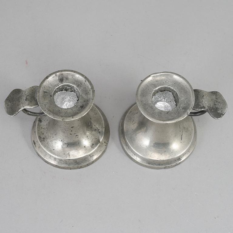 A pair of 19th century pewter candlesticks.