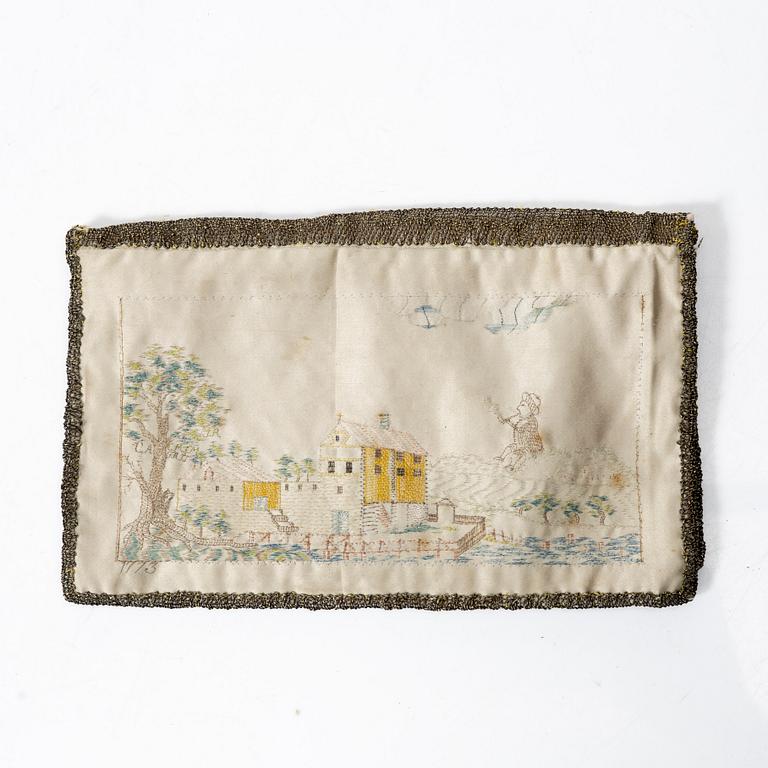 A silk embroidered wallet, dated 1773.