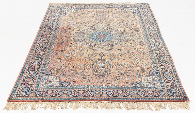 An oriental rug, circa 245 x 136 cm.