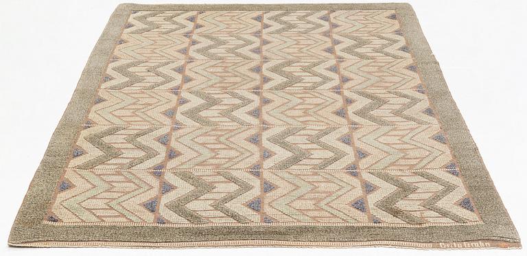 Brita Grahn, a carpet, knotted pile in relief, ca 239 x 168 cm (as well as 2,5 and 3,5 cm flat weave on each side), signed.