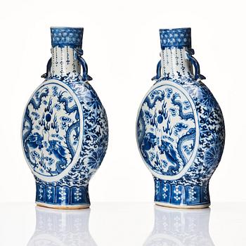 A pair of Chinese blue and white pilgrim vases, Qing dynasty, 19th Century.