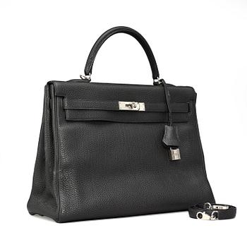 505. HERMÈS, a black veau togo, "Kelly 35".