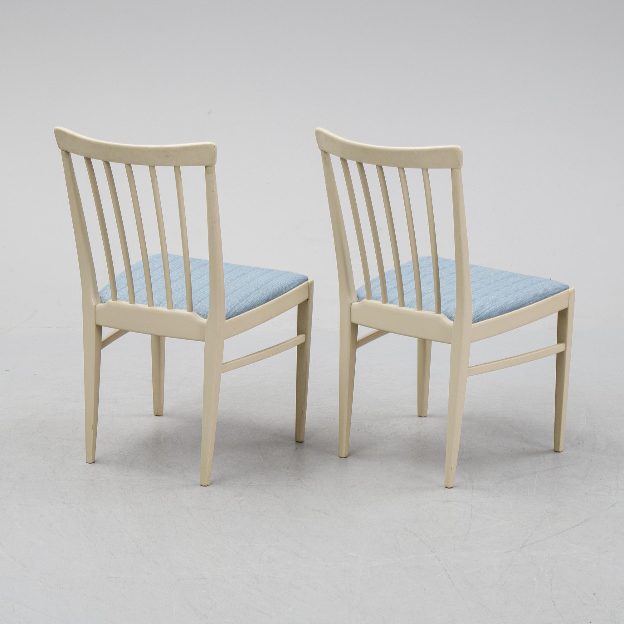 A dining table with six chairs by Carl Malmsten, second half of the 20th Century.