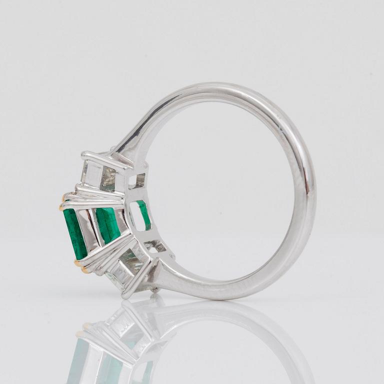 A 2.37 ct step-cut emerald and baguette-cut diamond ring. Total carat weight of diamonds circa 1.00 ct.