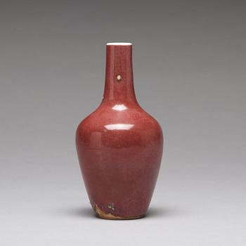 A sang de boef vase and bowl and an enamelled cup with cover and stand, Qing dynasty (1664-1912).