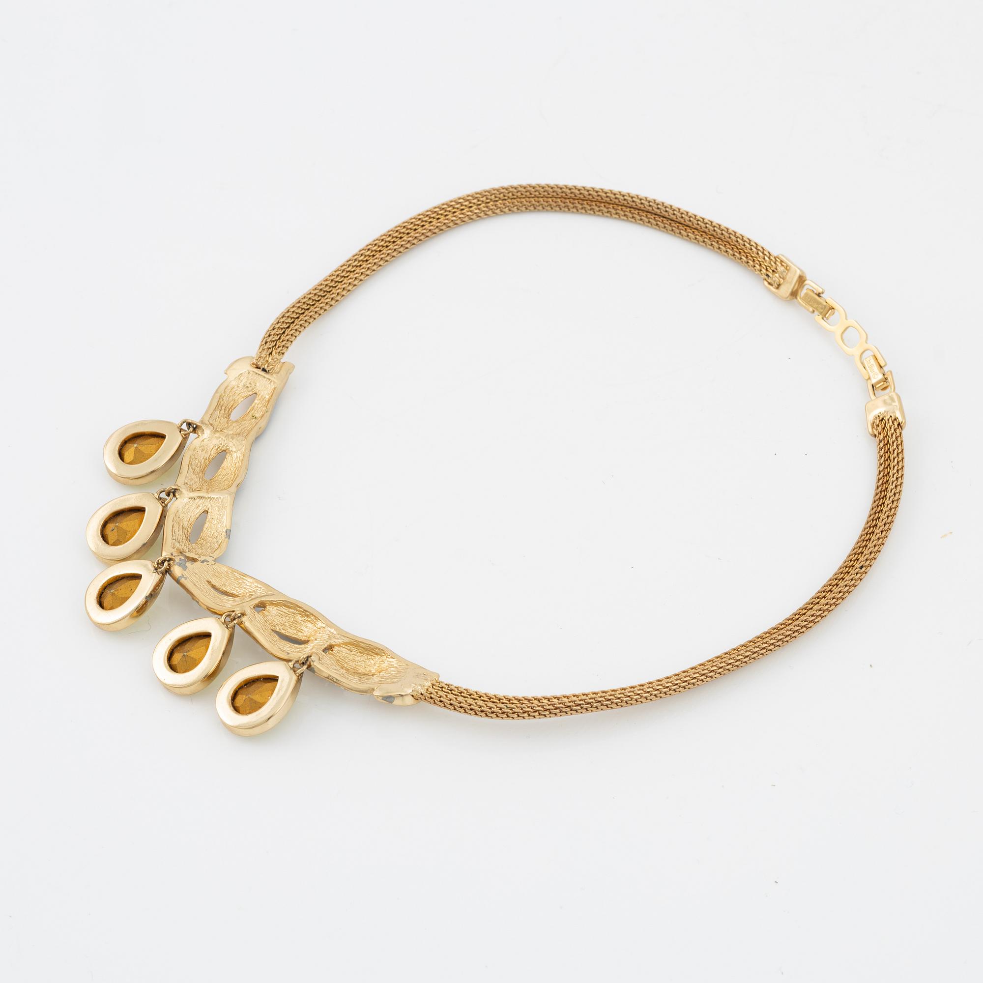 Christian Dior, a costume jewellery necklace and two pairs of earrings.
