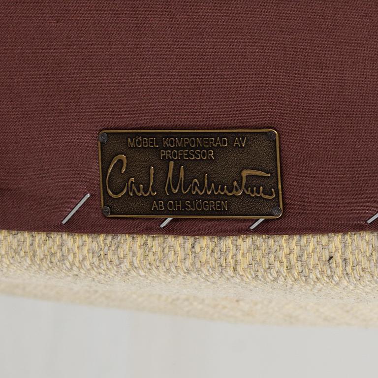 A pair of second half of the 20th century 'Hemmakväll' easy chairs by Carl Malmsten.