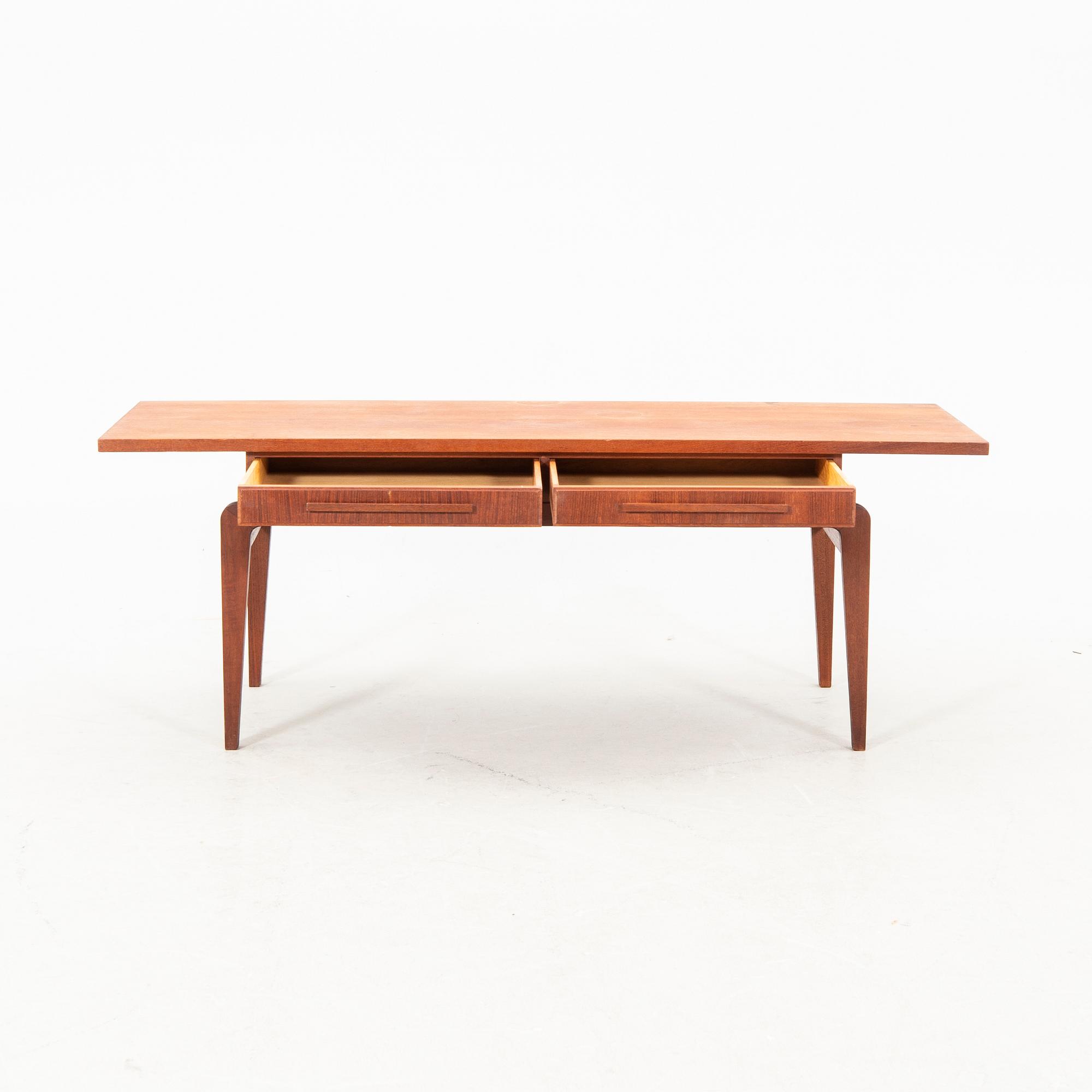 A teak coffee table from the middle of the 20th century.