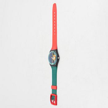 A wall clock, Swatch.