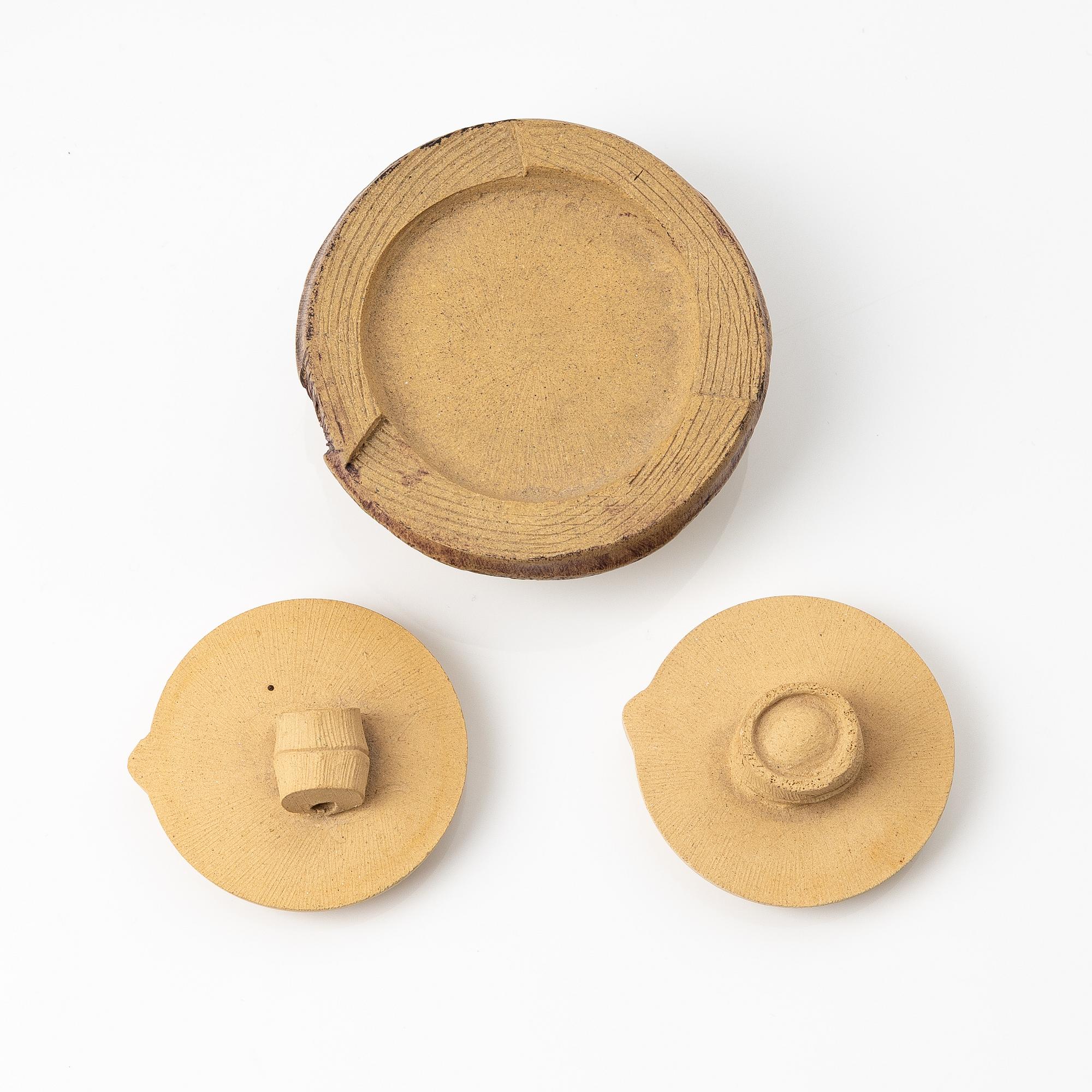 A group of three bright yellow yixing 'Gongfu' teapots, China, 1990s.